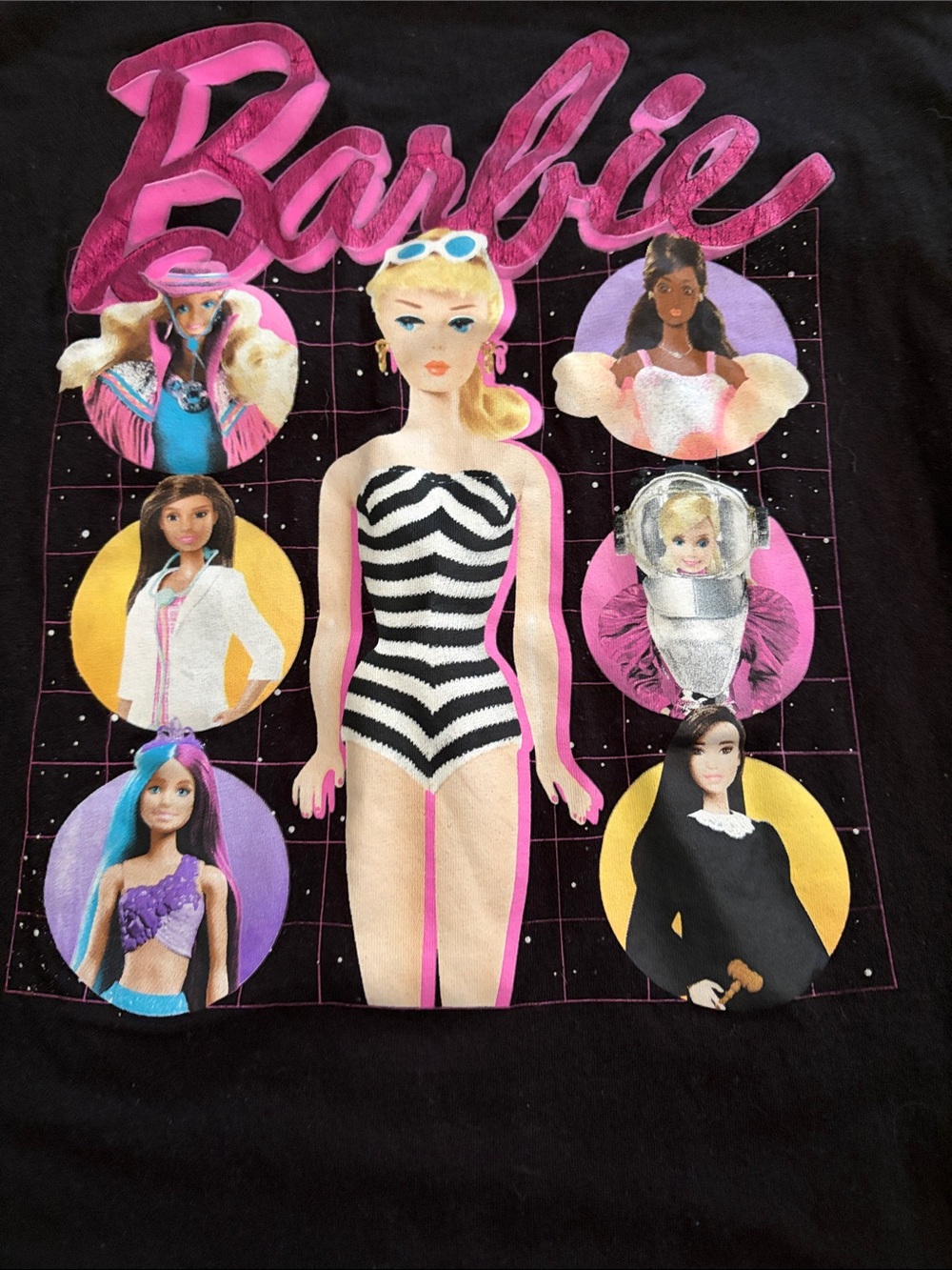 Barbie Black Graphic Tee with Pink, White & Yellow Dolls